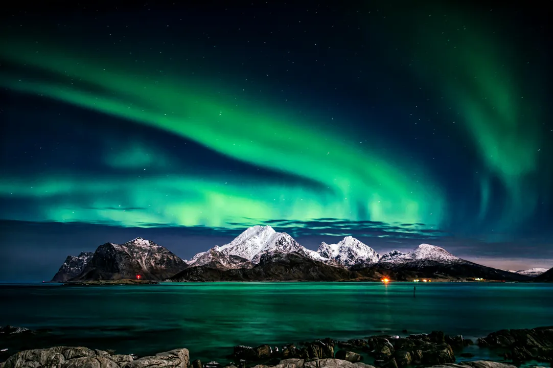 Aurora over mountains and sea