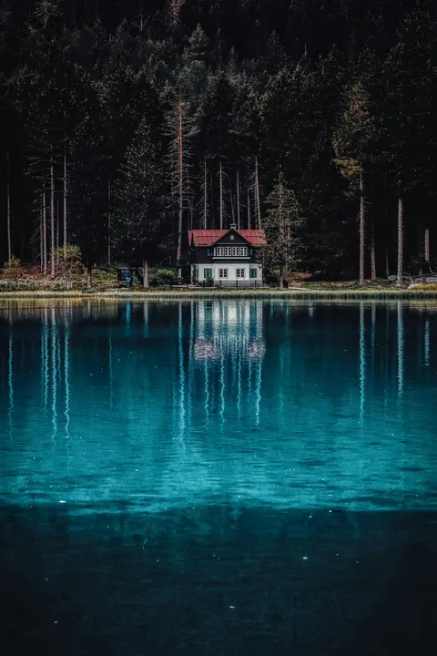 Cabin by lake with reflection